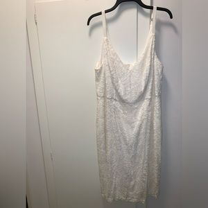 SOLD.Vanilla white lace dress. Adjustable straps and lined. Zipper back.